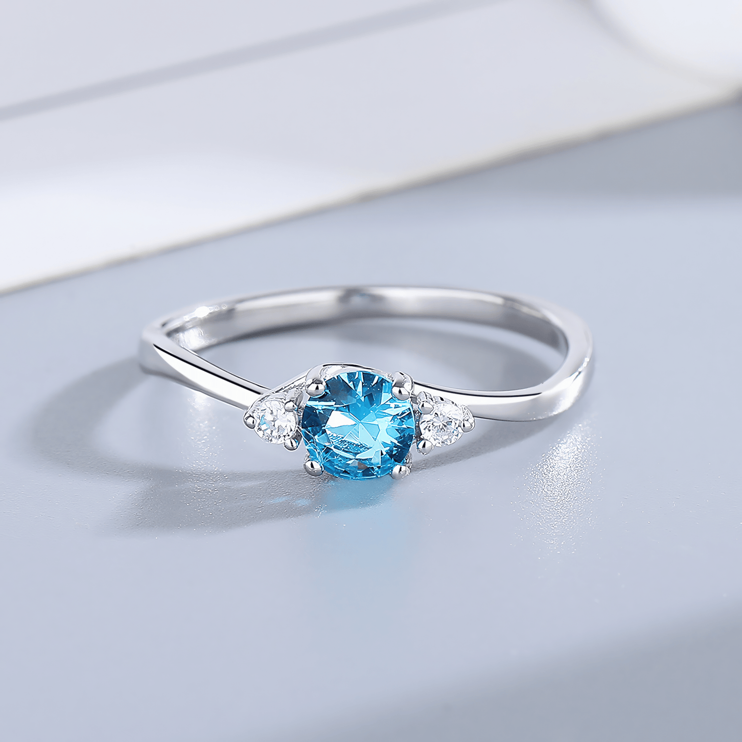 Azure Promise – Sterling Silver Ring with Oval Blue CZ and Side Accents - NAFALUXE