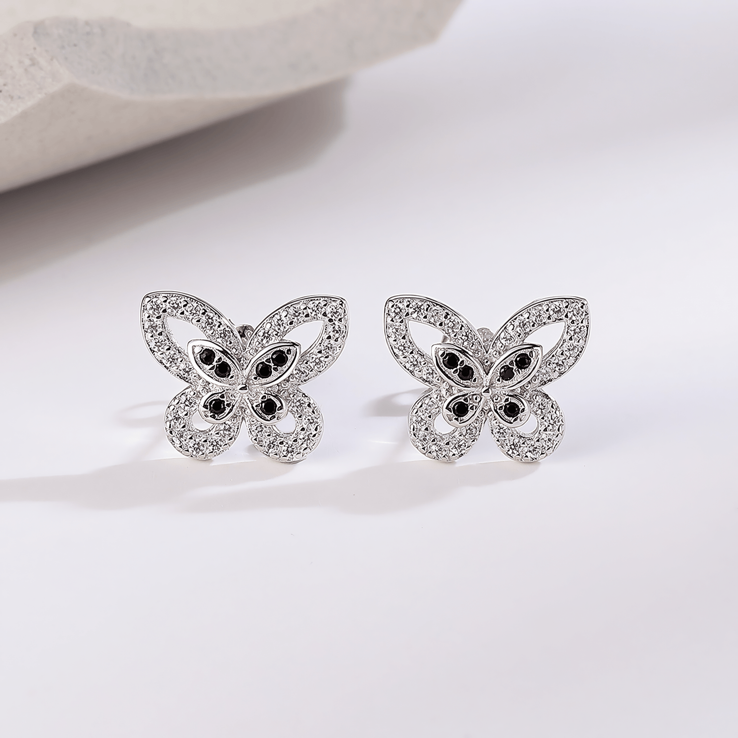 Elegant Butterfly Stud Earrings – 925 Sterling Silver with Black & White CZ - NAFALUXE