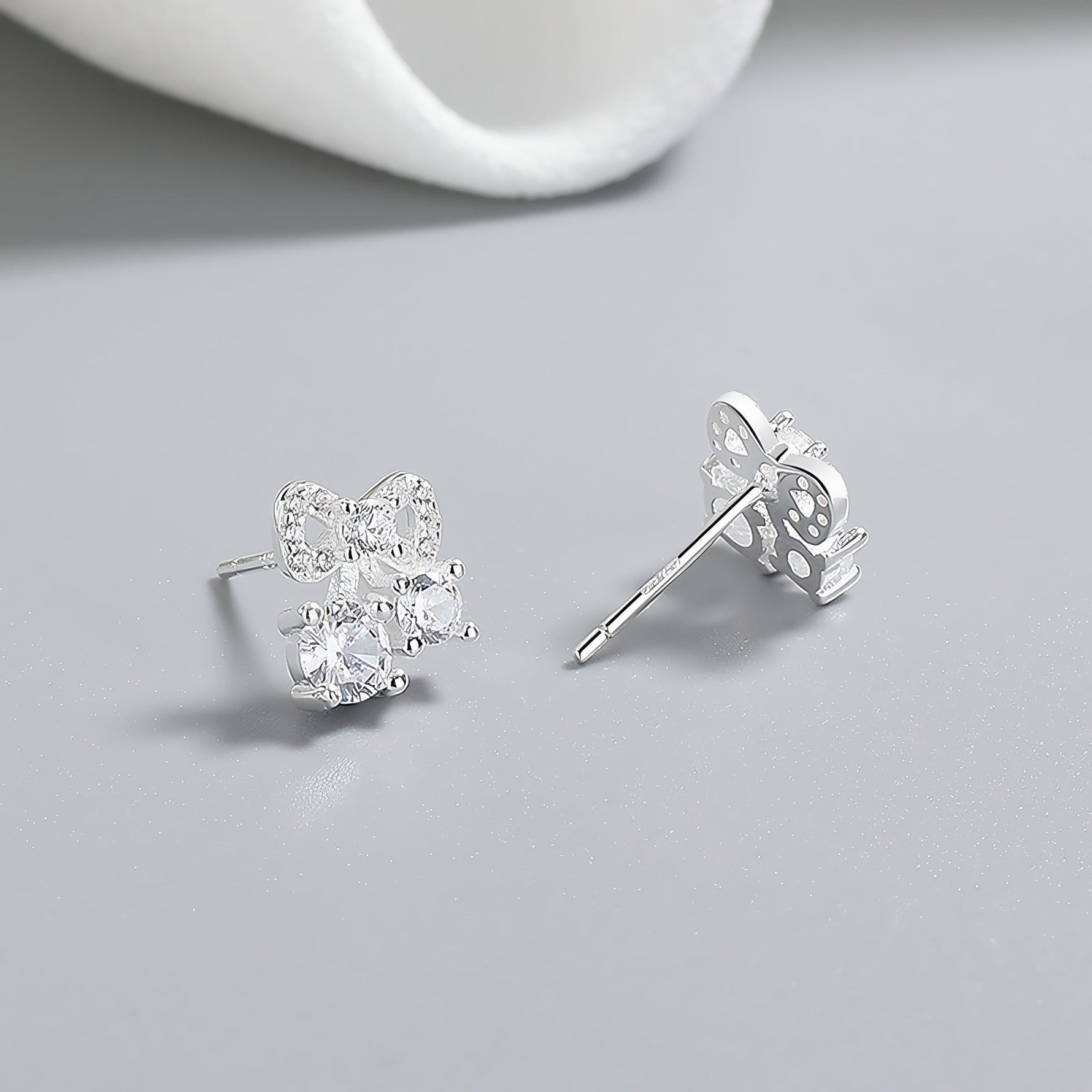 925 Sterling Silver Bow Stud Earrings with AAA Cubic Zirconia Trio - NAFALUXE