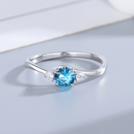 Azure Promise – Sterling Silver Ring with Oval Blue CZ and Side Accents - NAFALUXE