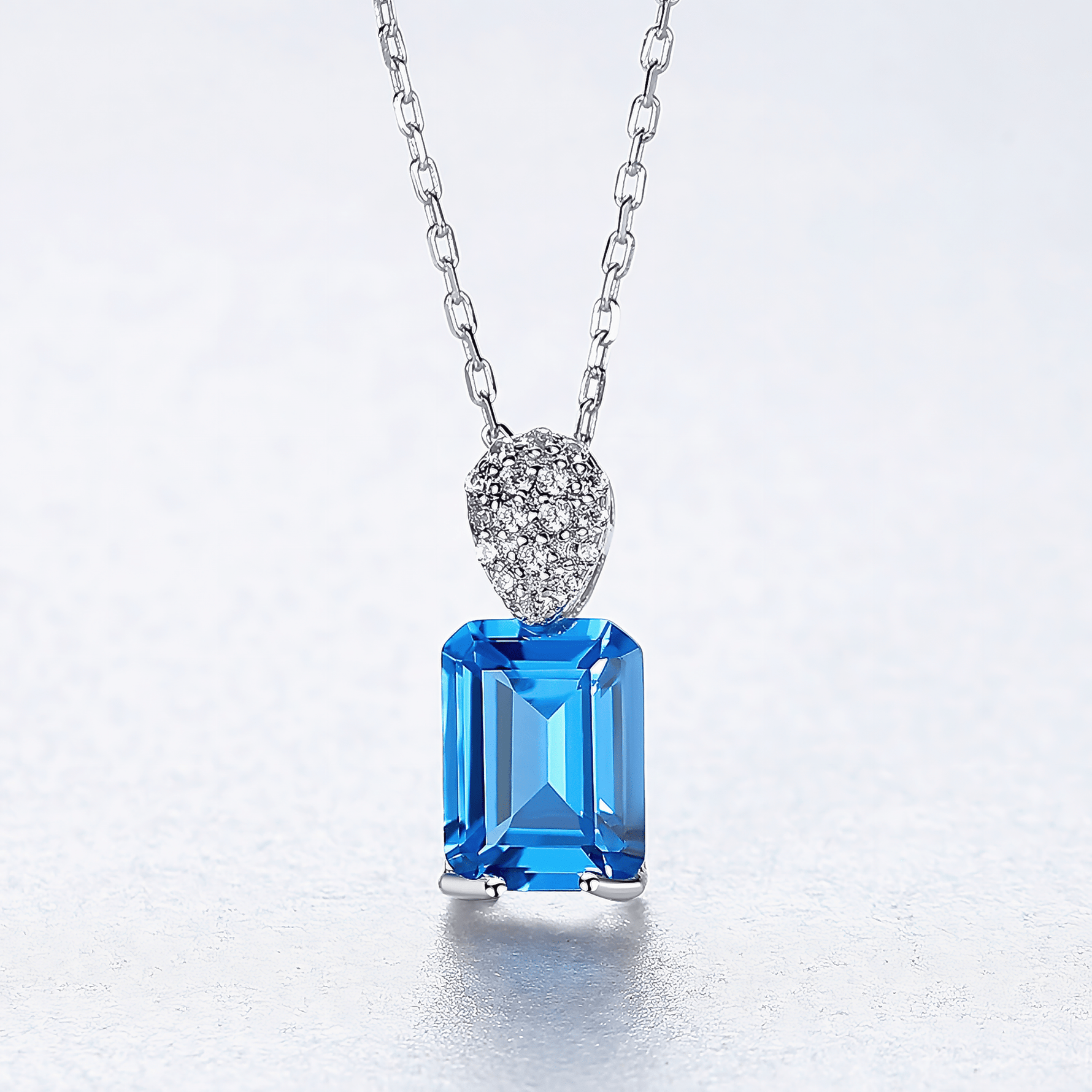 Elegant Blue Emerald - Cut CZ Sterling Silver Pendant Necklace - NAFALUXE