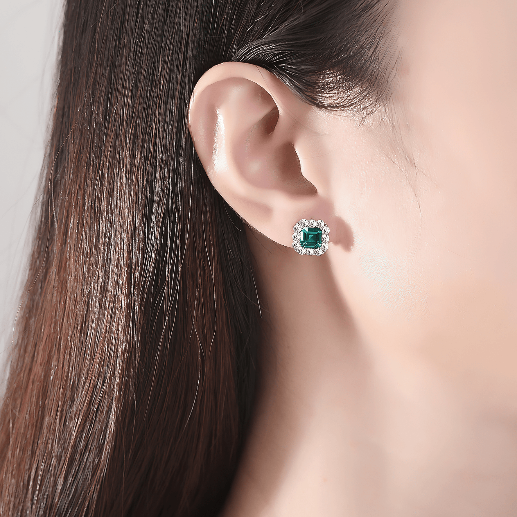 Elegant Emerald - Cut Aqua Blue CZ Halo Stud Earrings in Sterling Silver - NAFALUXE