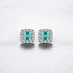 Elegant Emerald - Cut Aqua Blue CZ Halo Stud Earrings in Sterling Silver - NAFALUXE