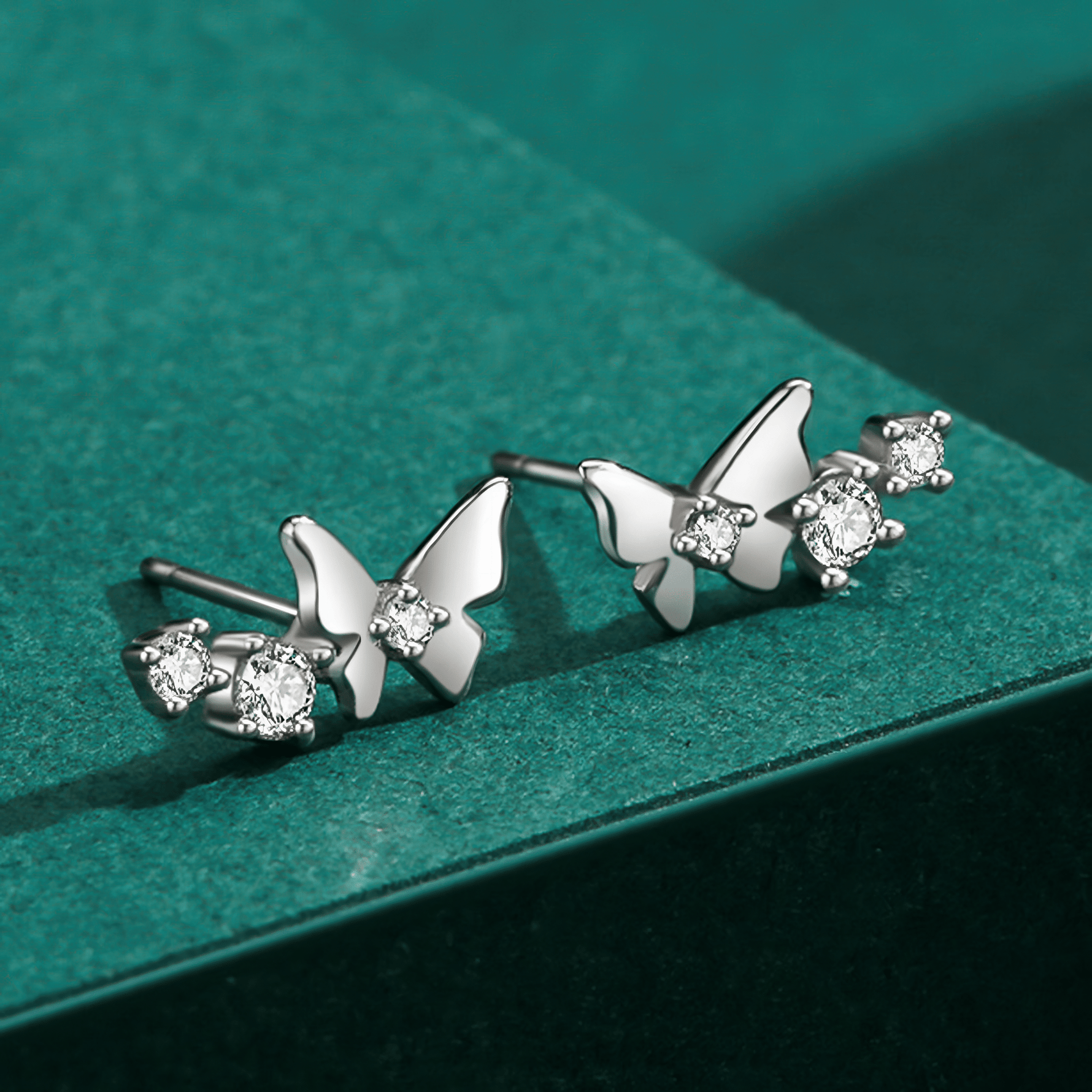Flutter Glow – Sterling Silver Butterfly Studs - NAFALUXE