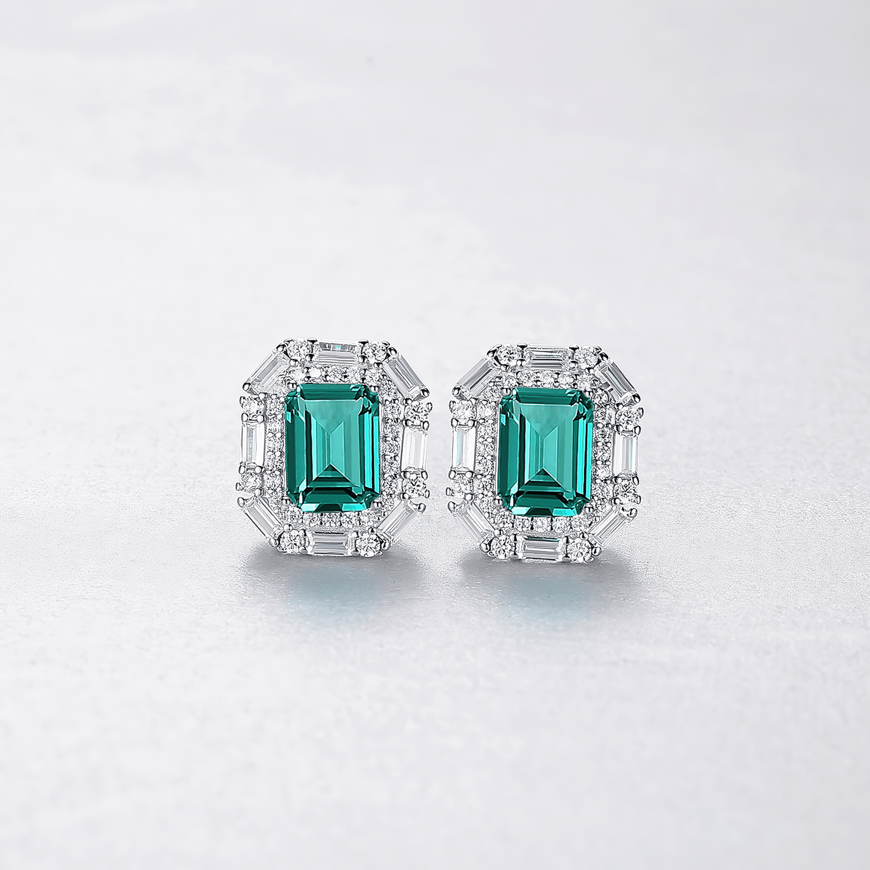 Luxury Emerald - Cut Green CZ Halo Stud Earrings in Sterling Silver - NAFALUXE