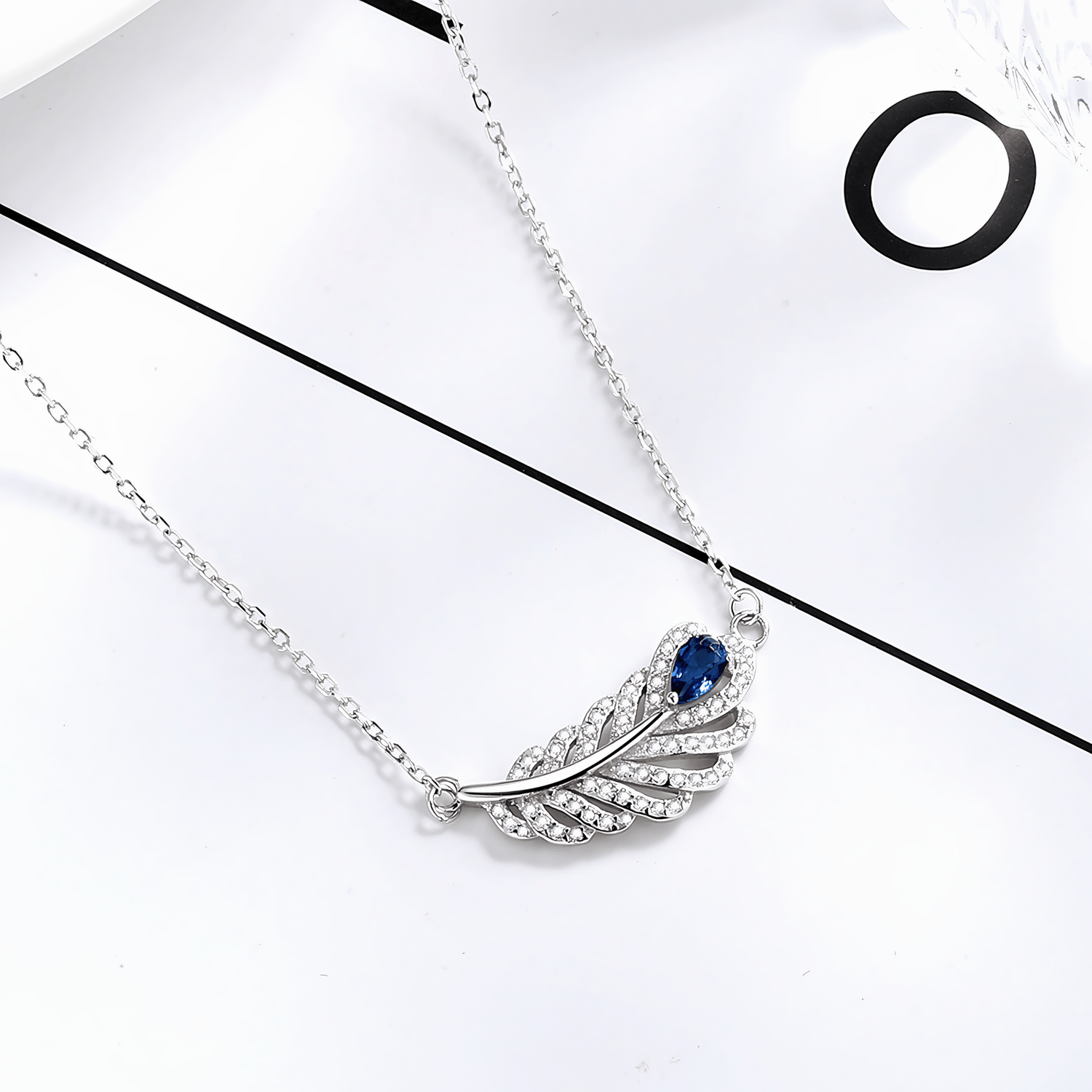 Sterling Silver Feather Necklace with Blue Gemstone - NAFALUXE