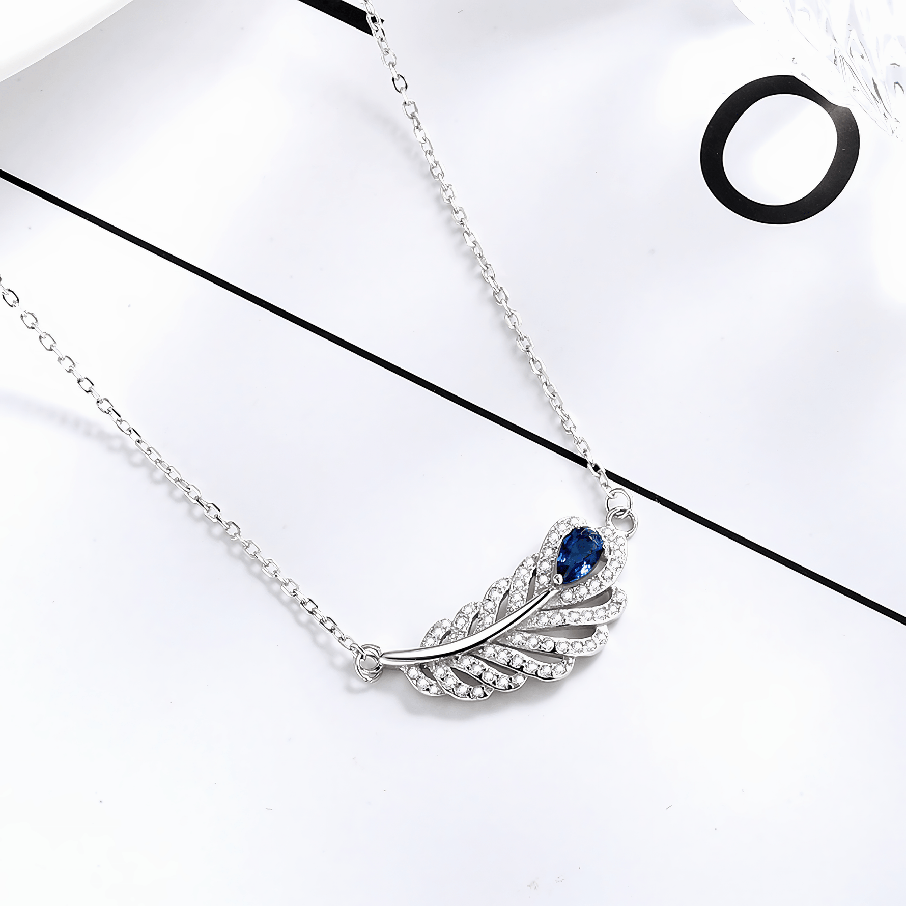 Sterling Silver Feather Necklace with Blue Gemstone - NAFALUXE